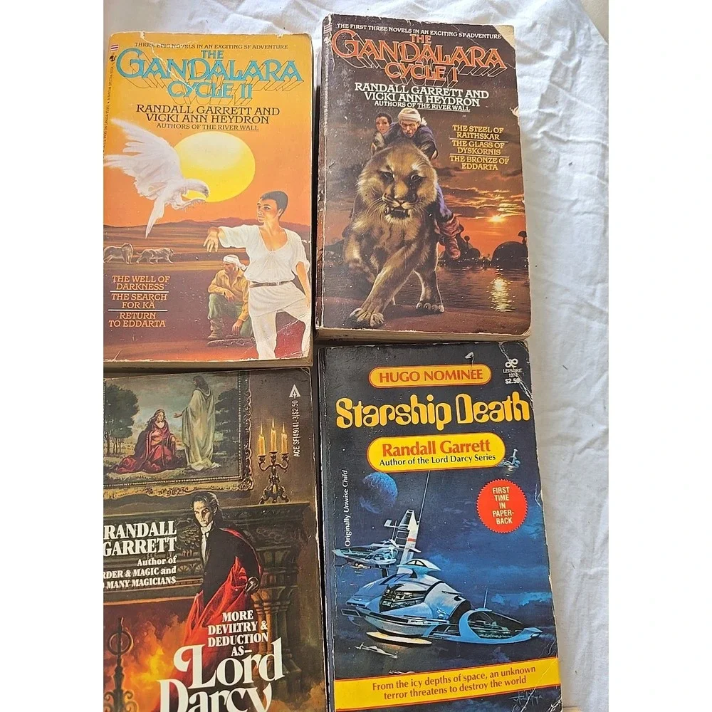Lot of 9 Randall Garrett, Lisa Goldstein, Rick Cook & Christie Golden PB Books